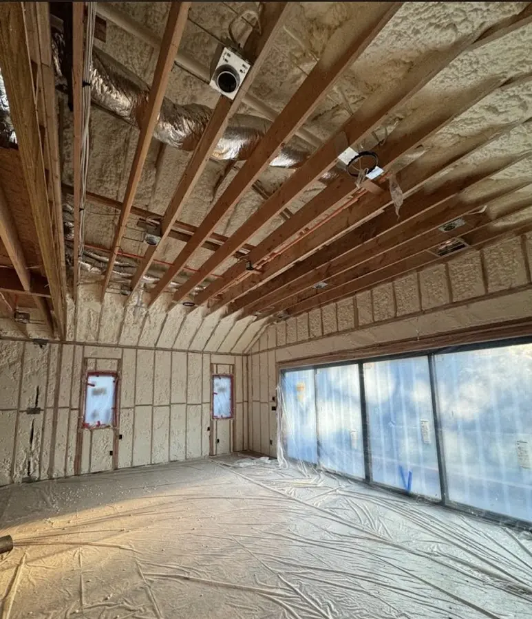 Interior walls and ceiling insulated with spray foam during new construction in Orchard Mesa